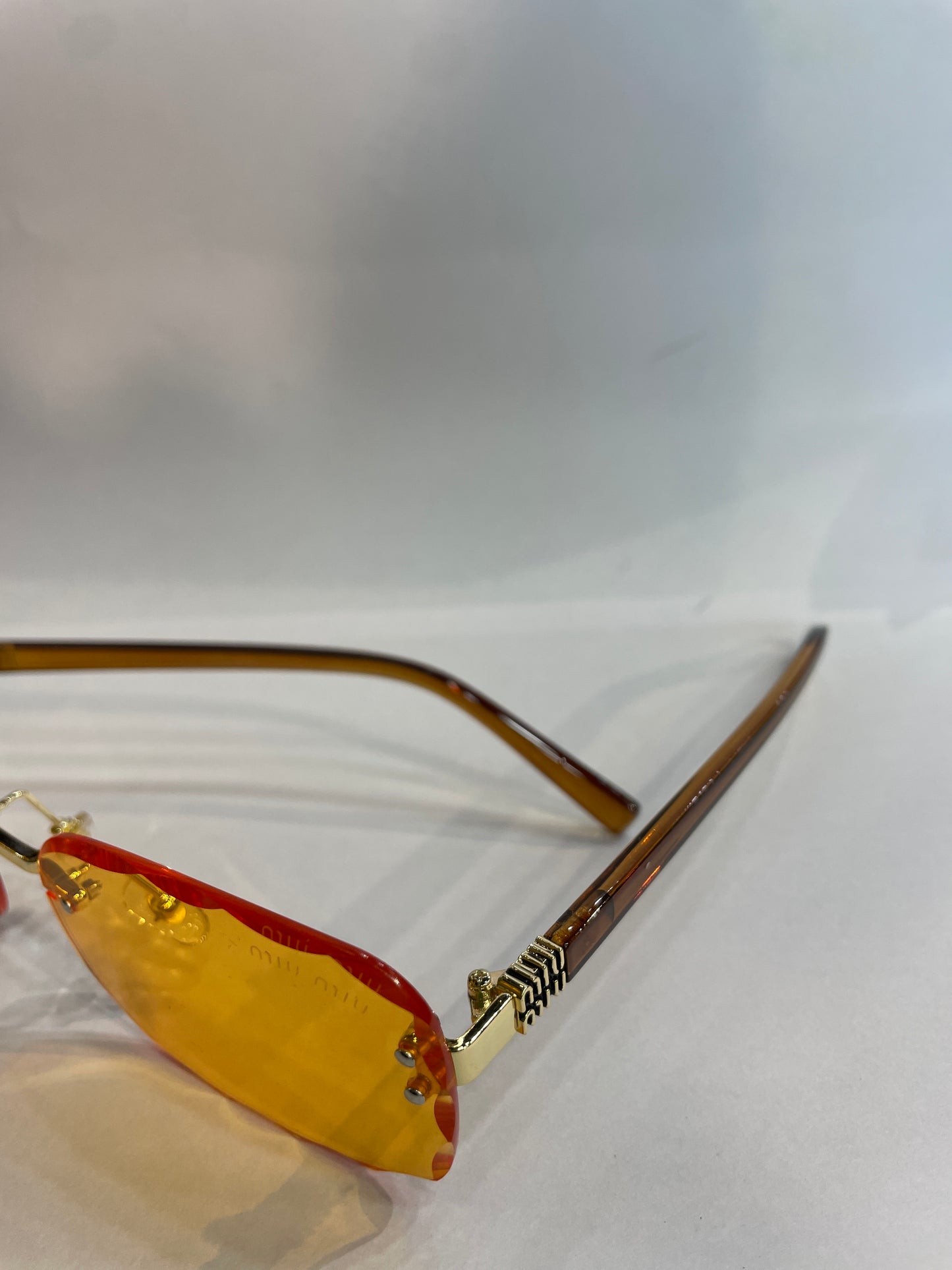 UIM MIU Brown Stick Frameless Orange Shade Unisex Sunglass SUN2031