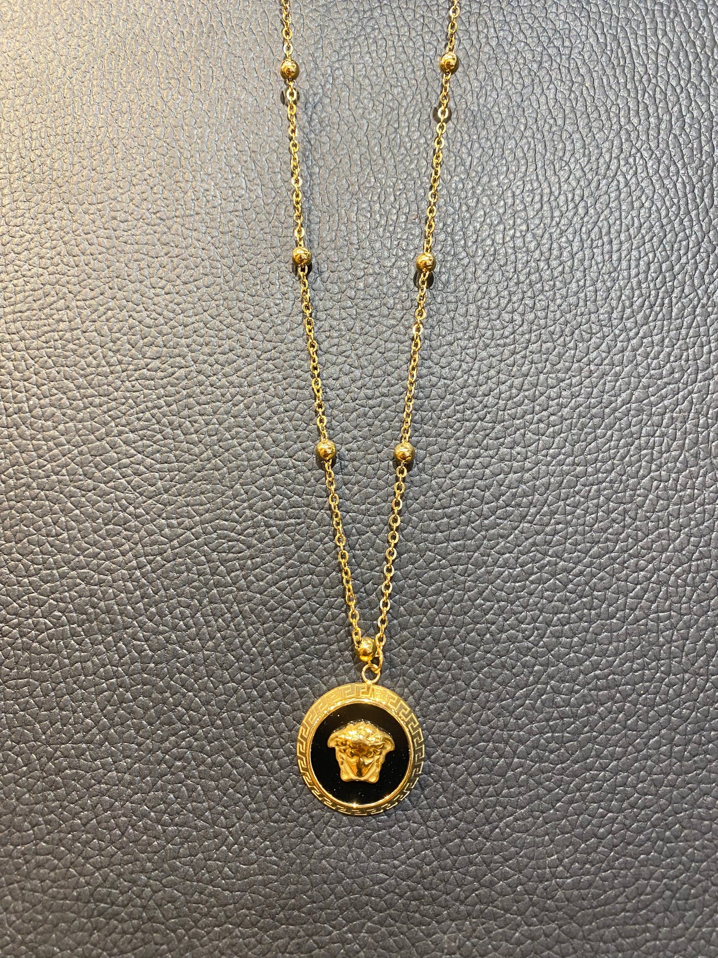 REV VER Gold Black Colour Pendant 987634