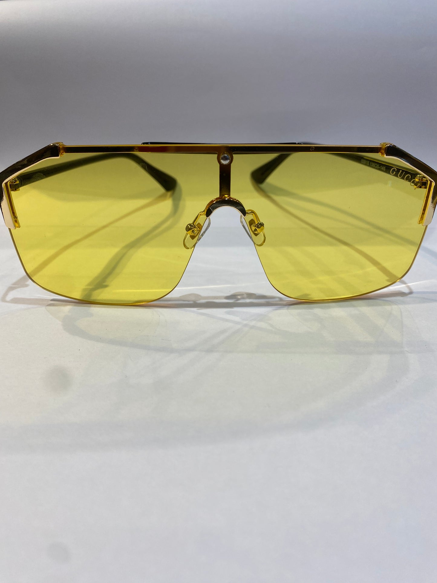 CUG Gold Black Frame Yellow Shade Unisex Sunglasses 0291 135 0 145